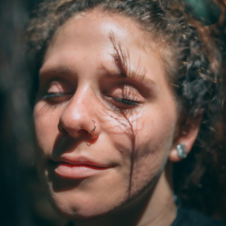 Avery Chen, Lead Design Curator at Solar Terralis, reviewing corporate floral arrangements